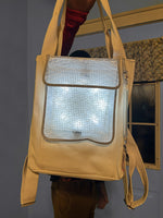 Load image into Gallery viewer, Person holding SolaPack backpack from straps.