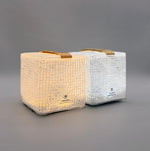 Load image into Gallery viewer, Two SolarPuff lanterns in studio, showing warm and bright white hybrid light settings