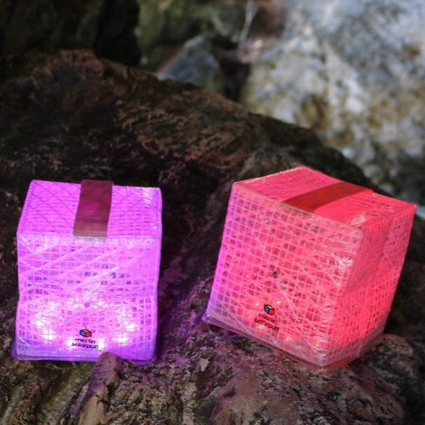 Colored Solar lantern for any hiking or camping trip shown here SolarPuff Multi-colored lamp on the rugged rocks of Bermuda.