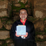 Load image into Gallery viewer, Young woman holding SolarPuff solar lantern.
