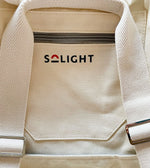 Load image into Gallery viewer, Solight backpack close up showing solight logo.

