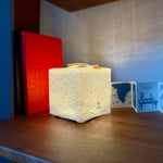 Load image into Gallery viewer, SolarPuff hybrid light on a shelf.
