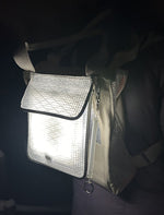 Load image into Gallery viewer, Backpack with keychain illuminated by solar lantern and power bank.
