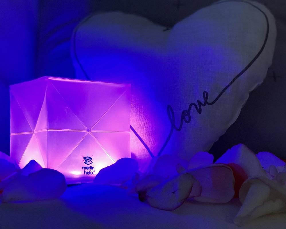 COLOR SOLAR LANTERNS - solar-lamp-outdoor-inddor-light- this shows the light on a couch with a pillow that is heart shaped and love is written on it.Multipacks solight2.myshopify.com
