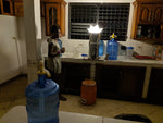 Load image into Gallery viewer, QWNN light illuminating room in Haiti.  This picture is taken in our partnering organization Hearthstone village and RMOF orphanage. 
