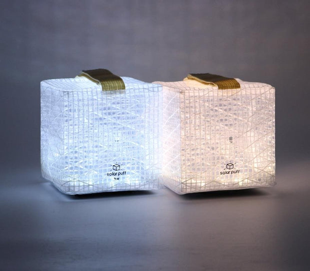 This shows two versions SOLAR LANTERN SolarPuff in bright white and in warm light. Beautiful spectrum of light  for indoors and out doors
