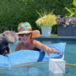 Load image into Gallery viewer, Woman reaching for Helix Hybrid lantern in pool, outdoor waterproof use

