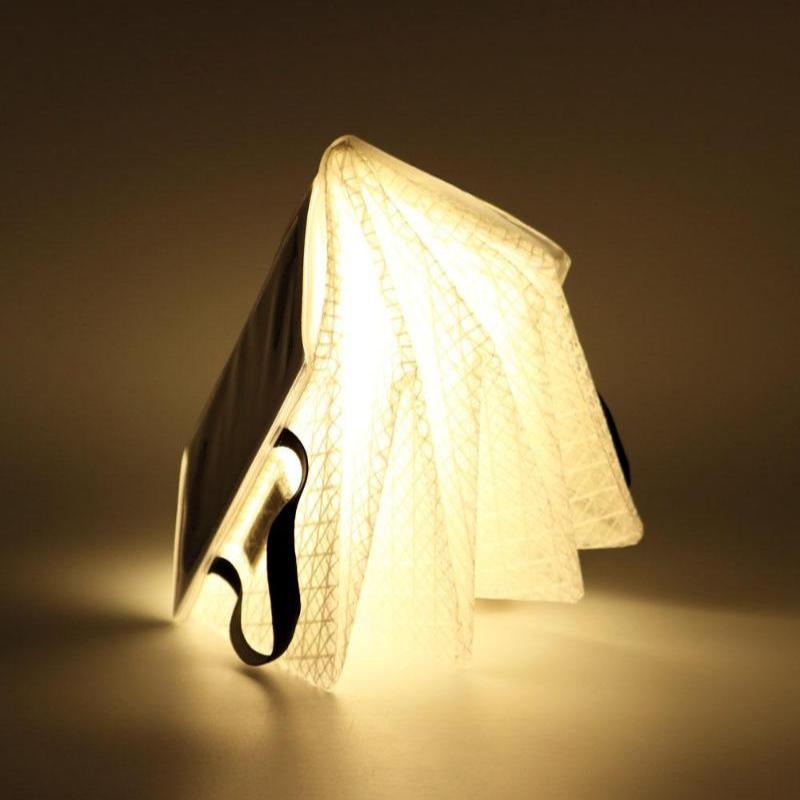 QWNN lantern in folded night light mode with soft warm glow