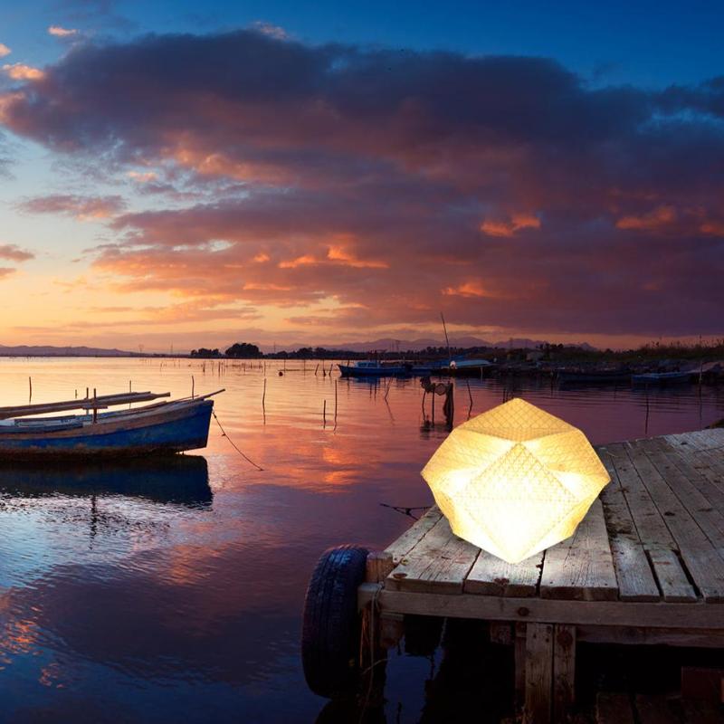 QWNN solar dome light placed on dock for outdoor ambiance