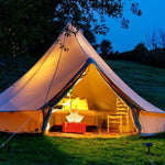 Load image into Gallery viewer, QWNN lantern illuminating interior of glamping tent with warm ambient light
