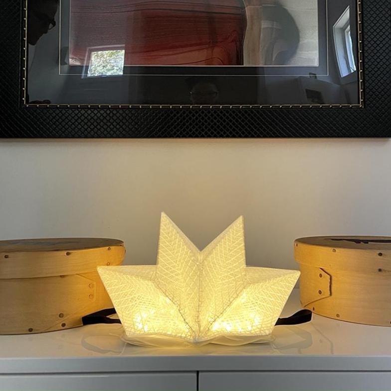 QWNN lantern on indoor table used as home lighting and modern decor