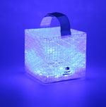 Load image into Gallery viewer, SolarPUFF multicolored lantern shown here in blue is used to fight depression in color therapy treatment. Light your evenings with different colors because the multi colored SolarPuff has an auto rotate button where all colors rotate by themselves!!
